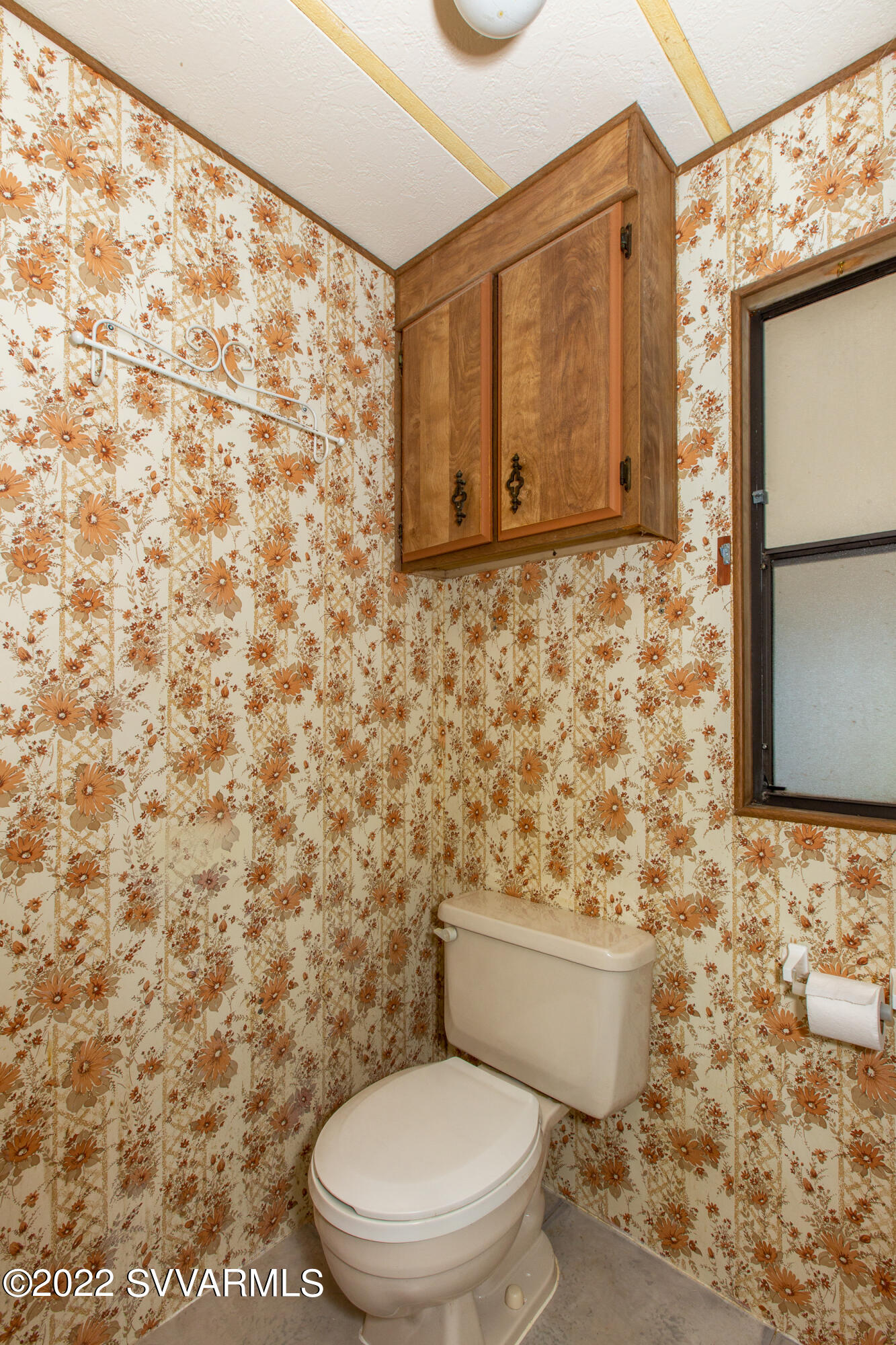 3765 East Valley Vista Road Rimrock, AZ 86335 - Photo 16 of 20 a toilet sitting in a bathroom next to a blue wall