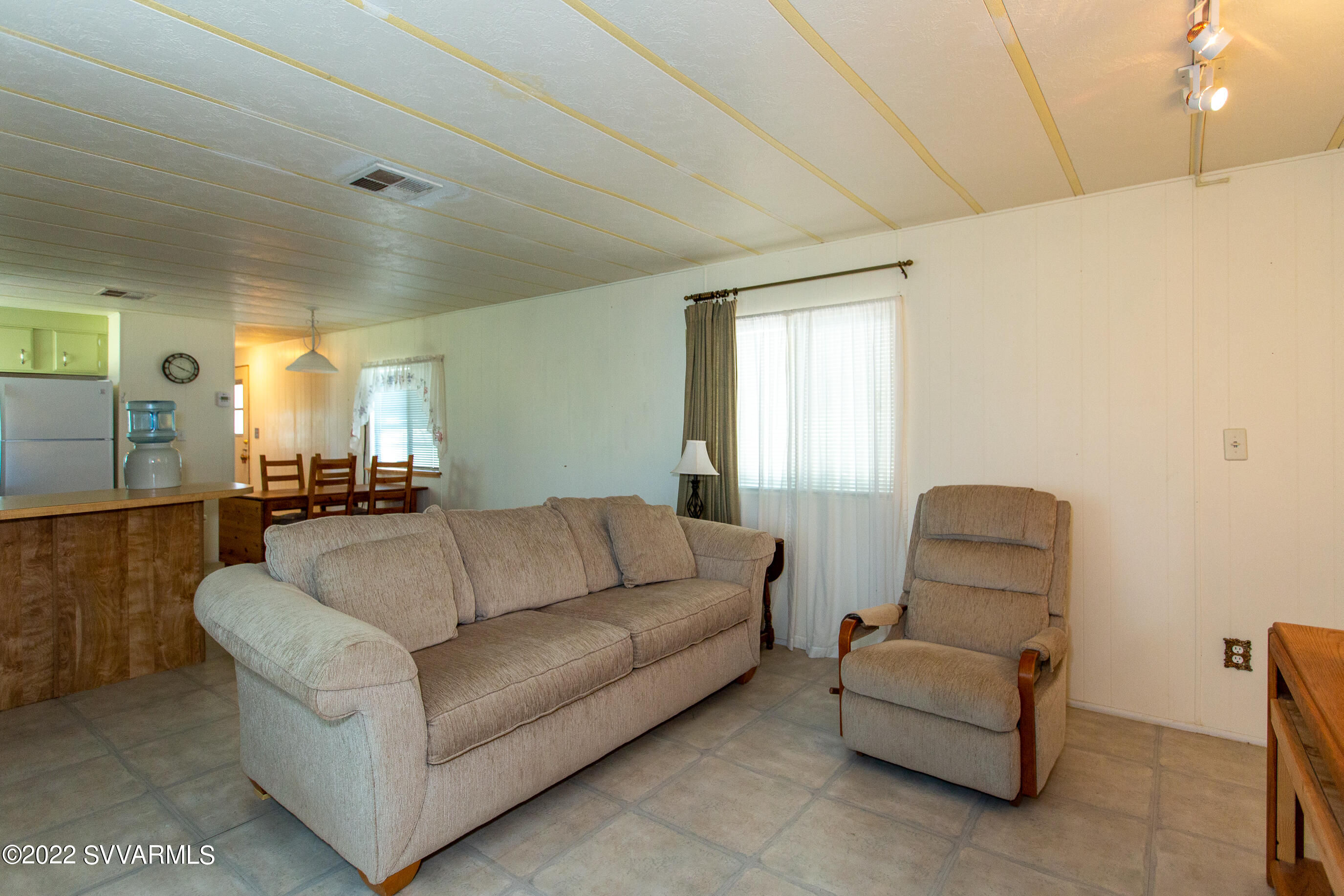 3765 East Valley Vista Road Rimrock, AZ 86335 - Photo 7 of 20 a living room with furniture and a window