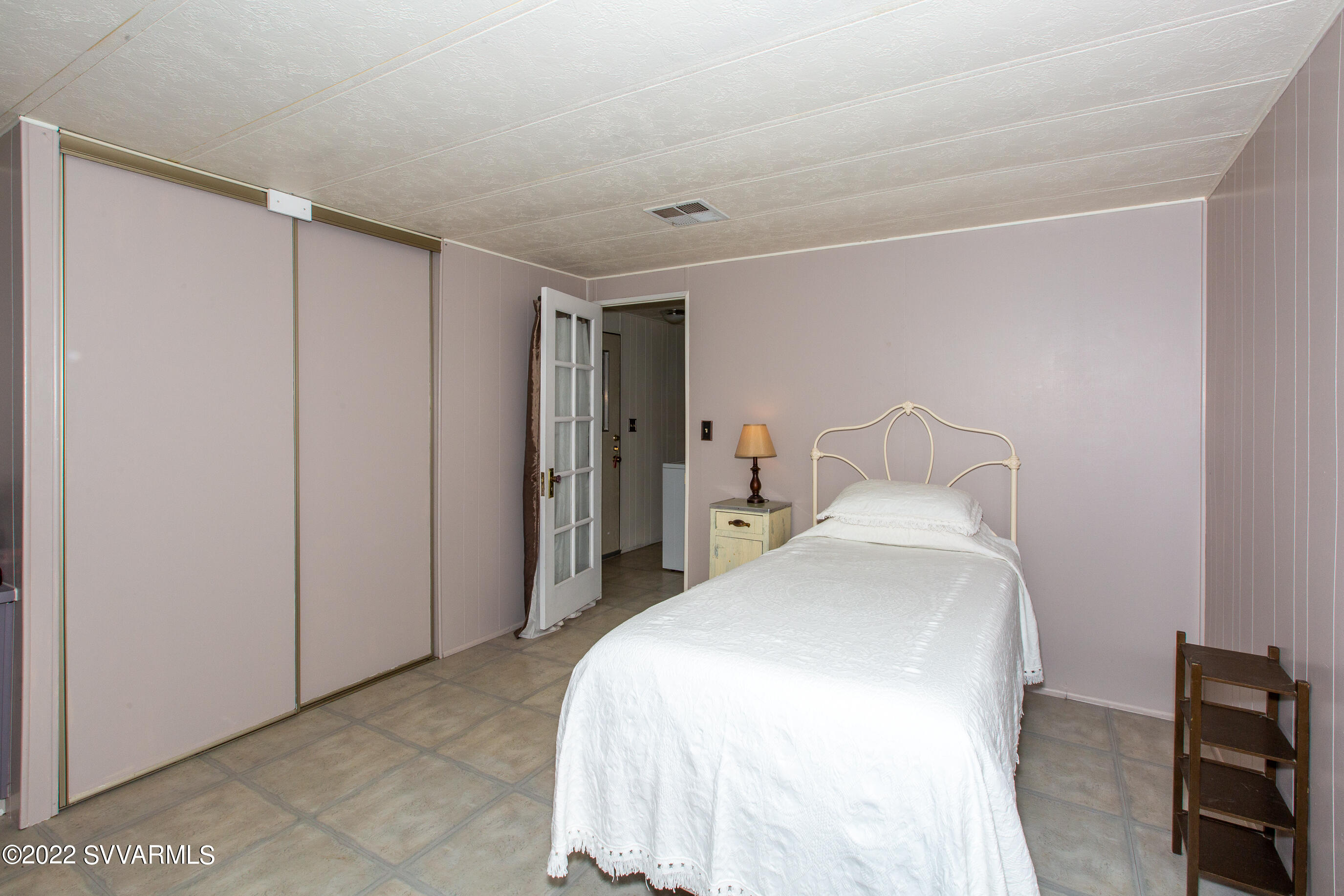 3765 East Valley Vista Road Rimrock, AZ 86335 - Photo 10 of 20 a bedroom with a bed and a table