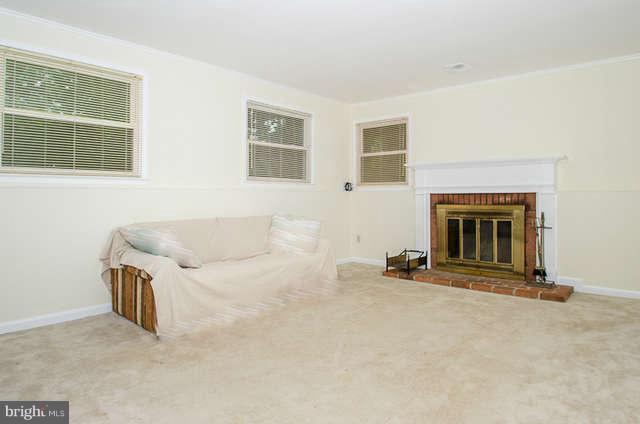 6915 Rochambeau Place Springfield, VA 22153 - Photo 14 of 23 a view of a livingroom with a fireplace and window
