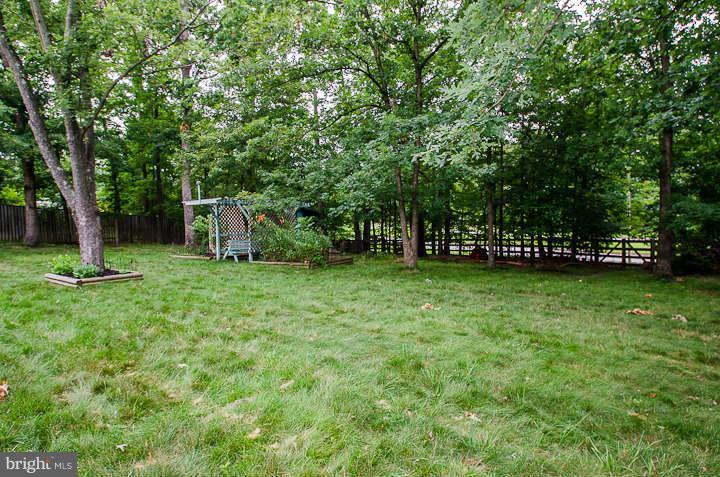 6915 Rochambeau Place Springfield, VA 22153 - Photo 22 of 23 a view of outdoor space with deck and yard