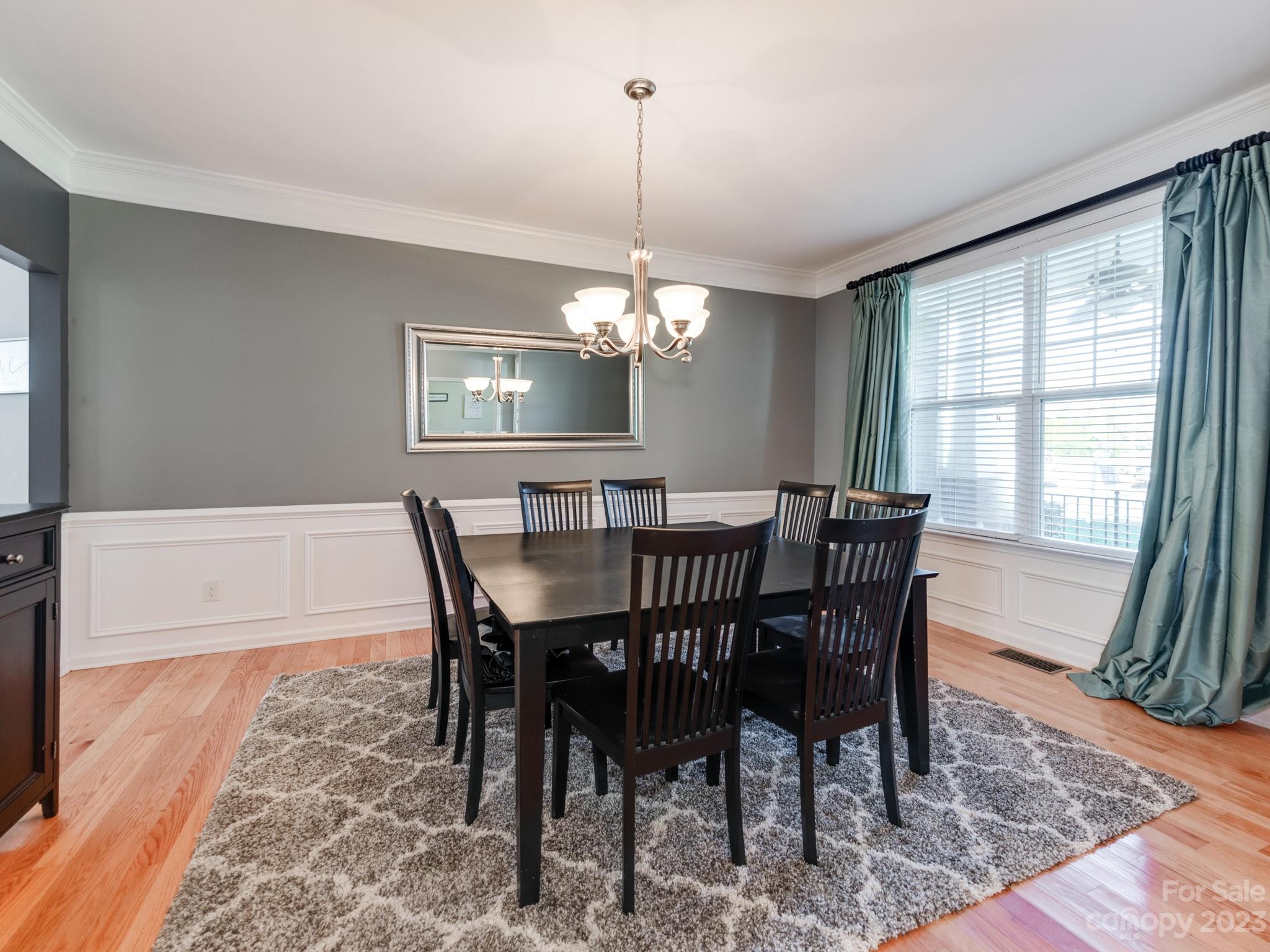 1603 Randwick Way Matthews, NC 28104 - Photo 11 of 48 a view of a dining room with furniture window and wooden floor