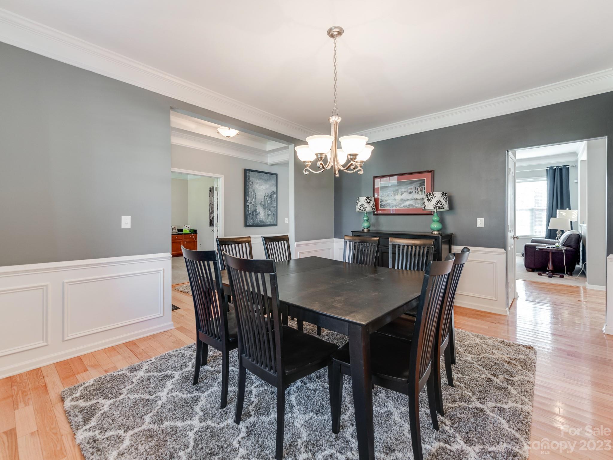 1603 Randwick Way Matthews, NC 28104 - Photo 12 of 48 a view of a dining room with furniture and wooden floor