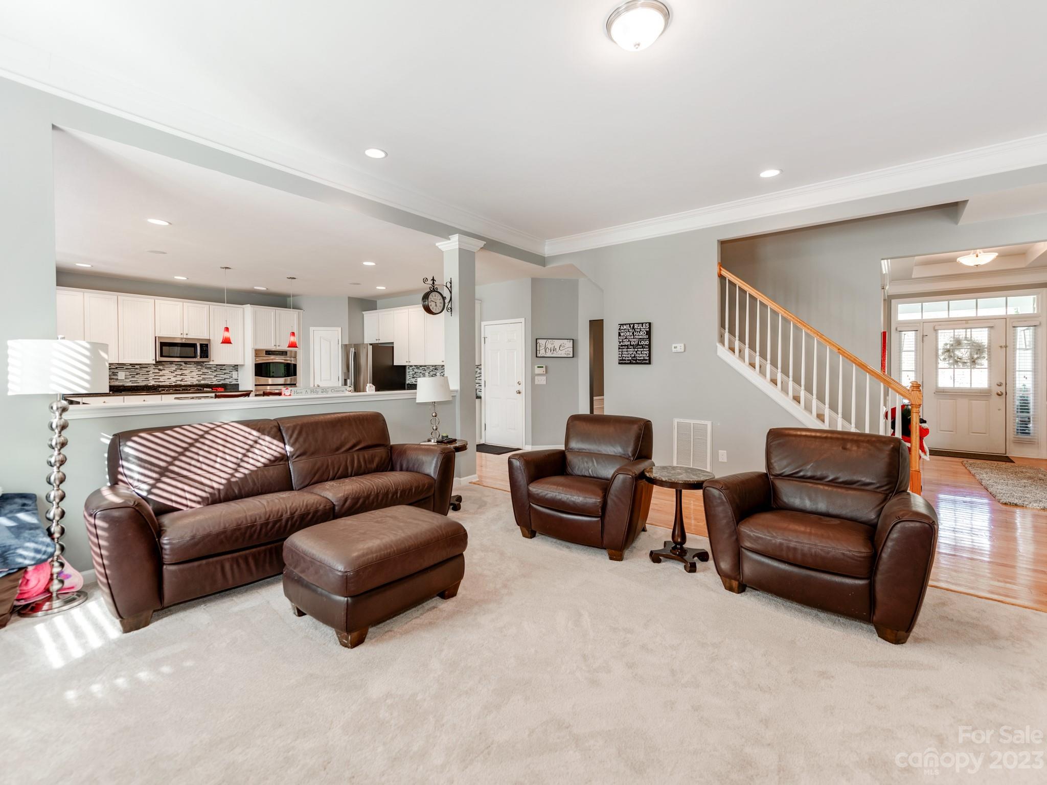 1603 Randwick Way Matthews, NC 28104 - Photo 16 of 48 a living room with furniture and a potted plant