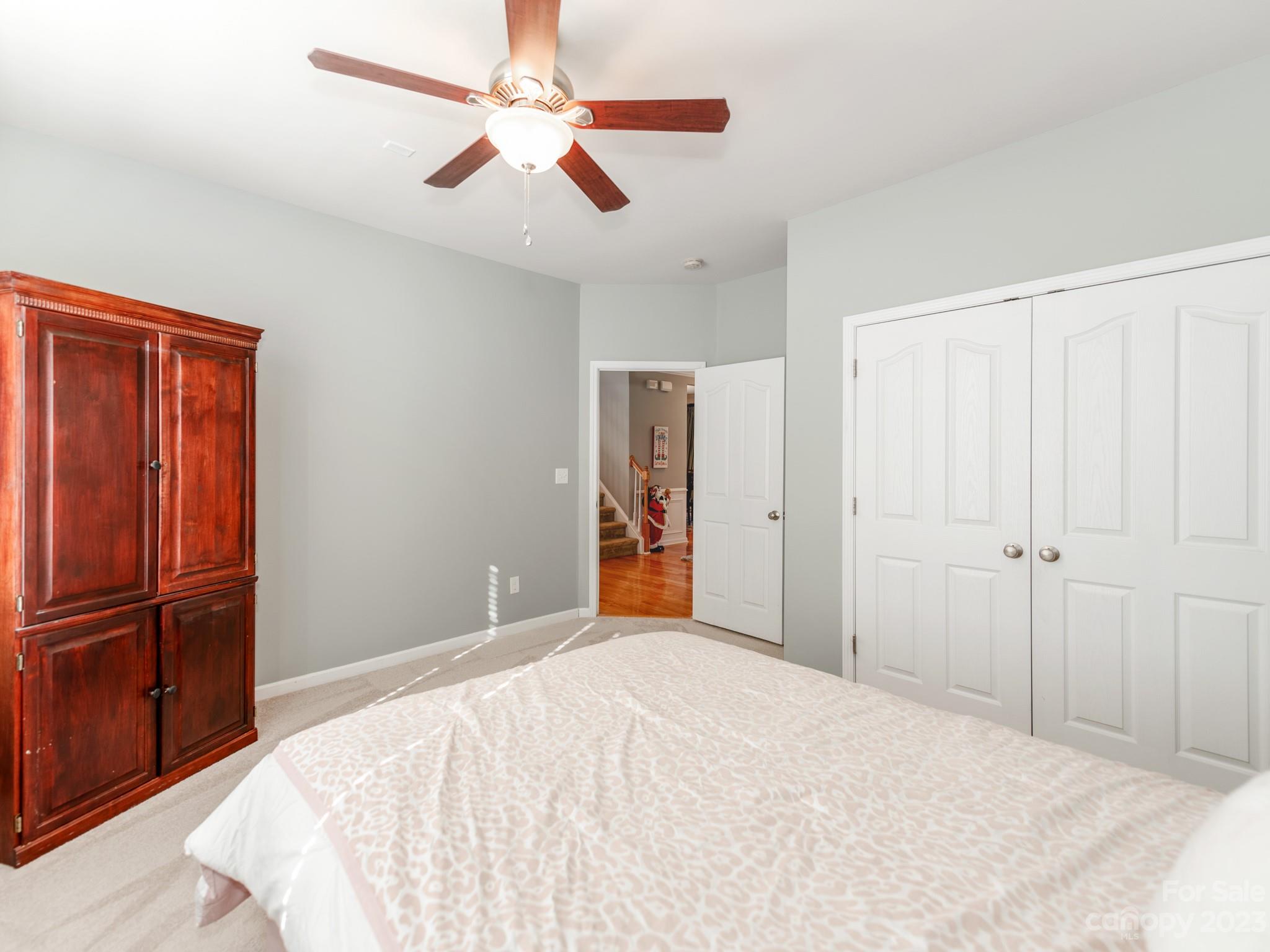 1603 Randwick Way Matthews, NC 28104 - Photo 25 of 48 a bedroom with a bed and a chandelier
