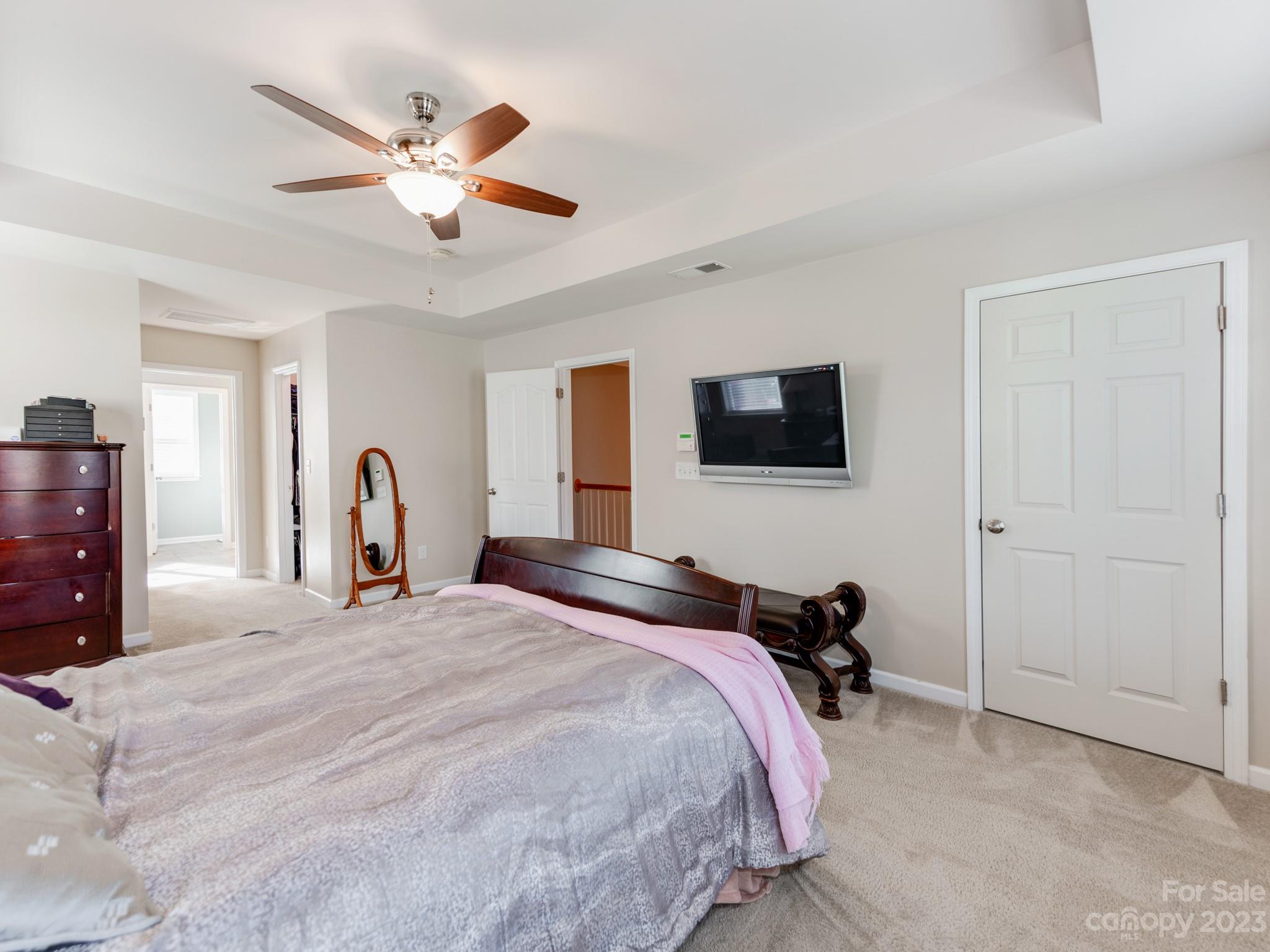 1603 Randwick Way Matthews, NC 28104 - Photo 29 of 48 a bedroom with a bed window and a flat screen tv