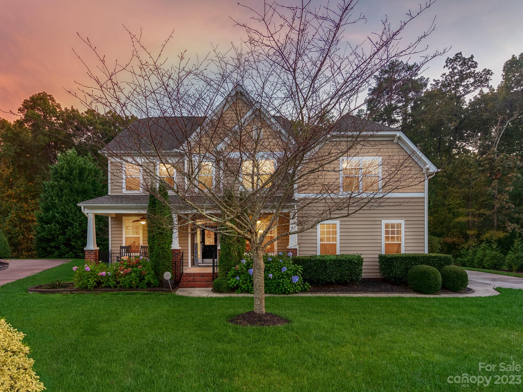 1603 Randwick Way Matthews, NC 28104 - Photo 3 of 48 a front view of a house with a garden