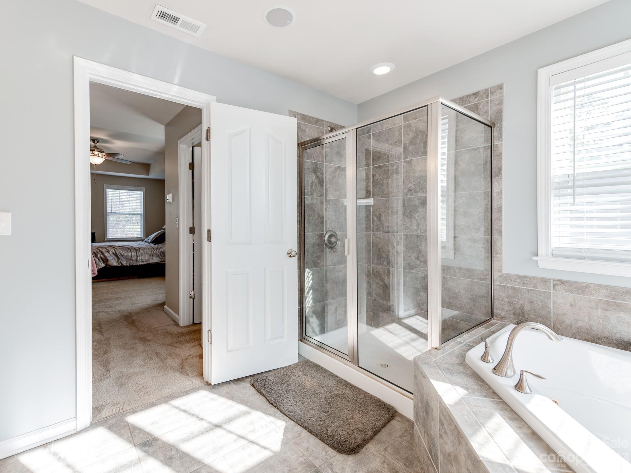 1603 Randwick Way Matthews, NC 28104 - Photo 31 of 48 a spacious bathroom with a tub shower and sink