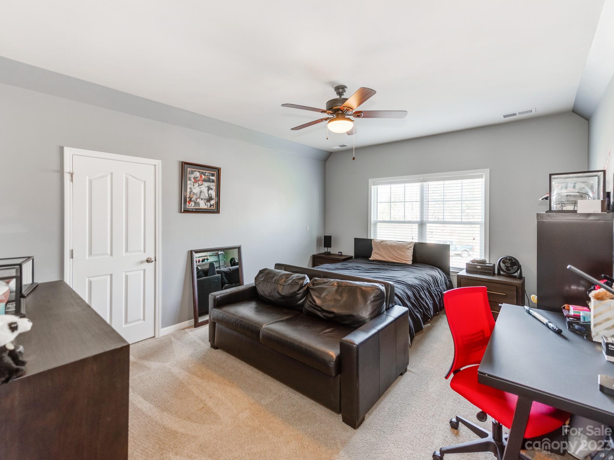 1603 Randwick Way Matthews, NC 28104 - Photo 32 of 48 a living room with furniture and a flat screen tv