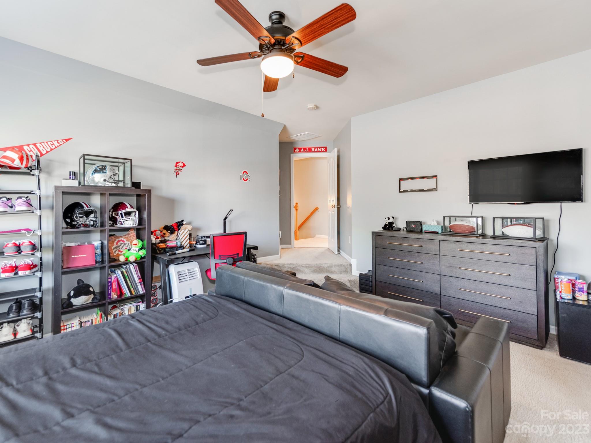 1603 Randwick Way Matthews, NC 28104 - Photo 33 of 48 a bedroom with bed and a flat tv screen