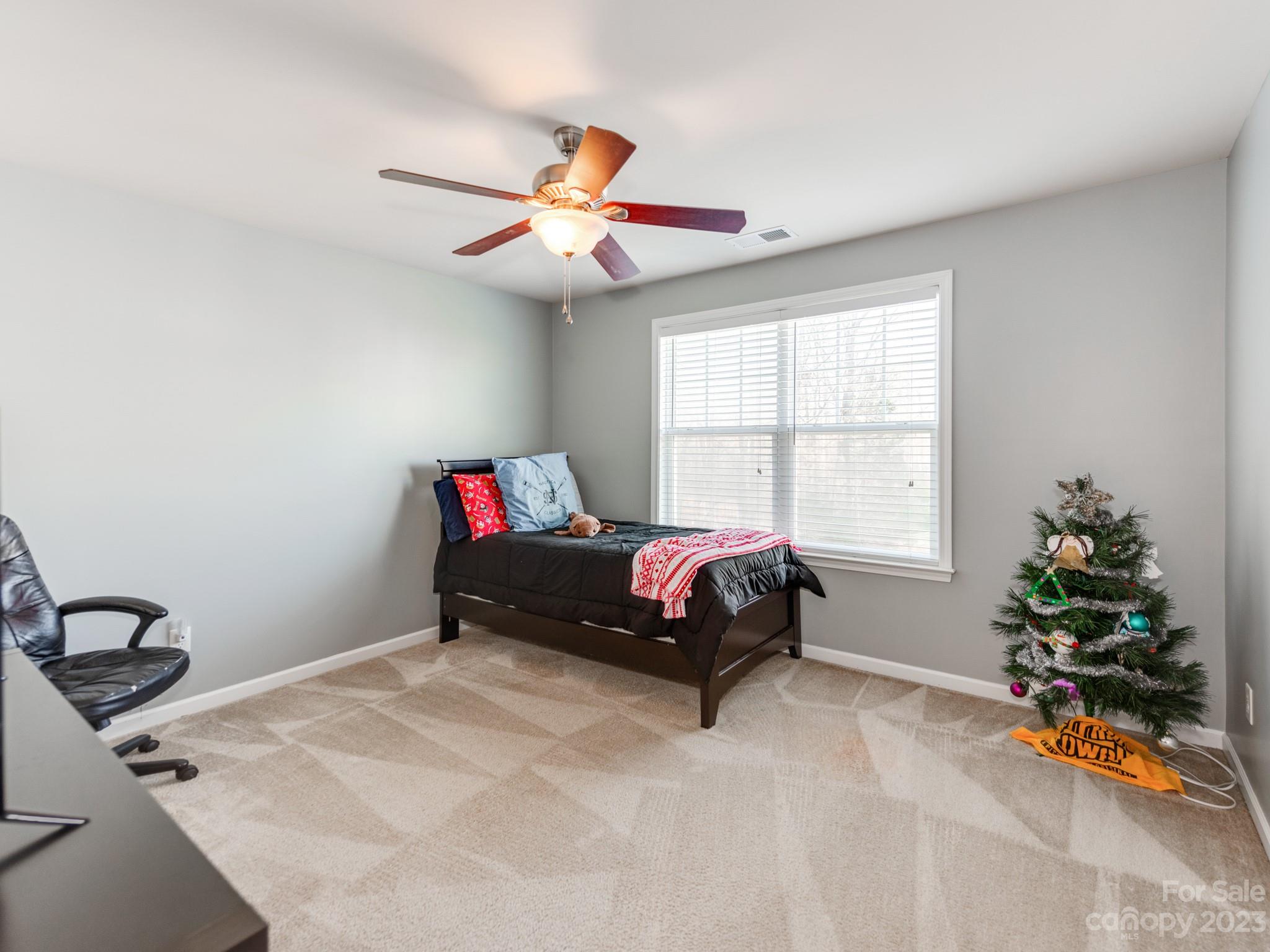 1603 Randwick Way Matthews, NC 28104 - Photo 36 of 48 a bedroom with a bed and a window