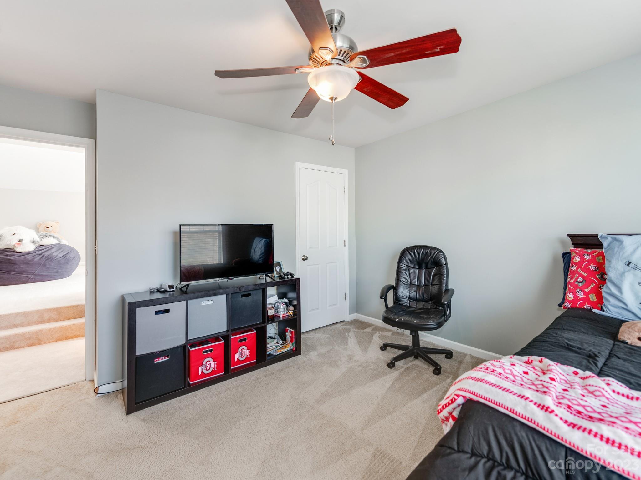 1603 Randwick Way Matthews, NC 28104 - Photo 37 of 48 a bedroom with a bed and a flat screen tv