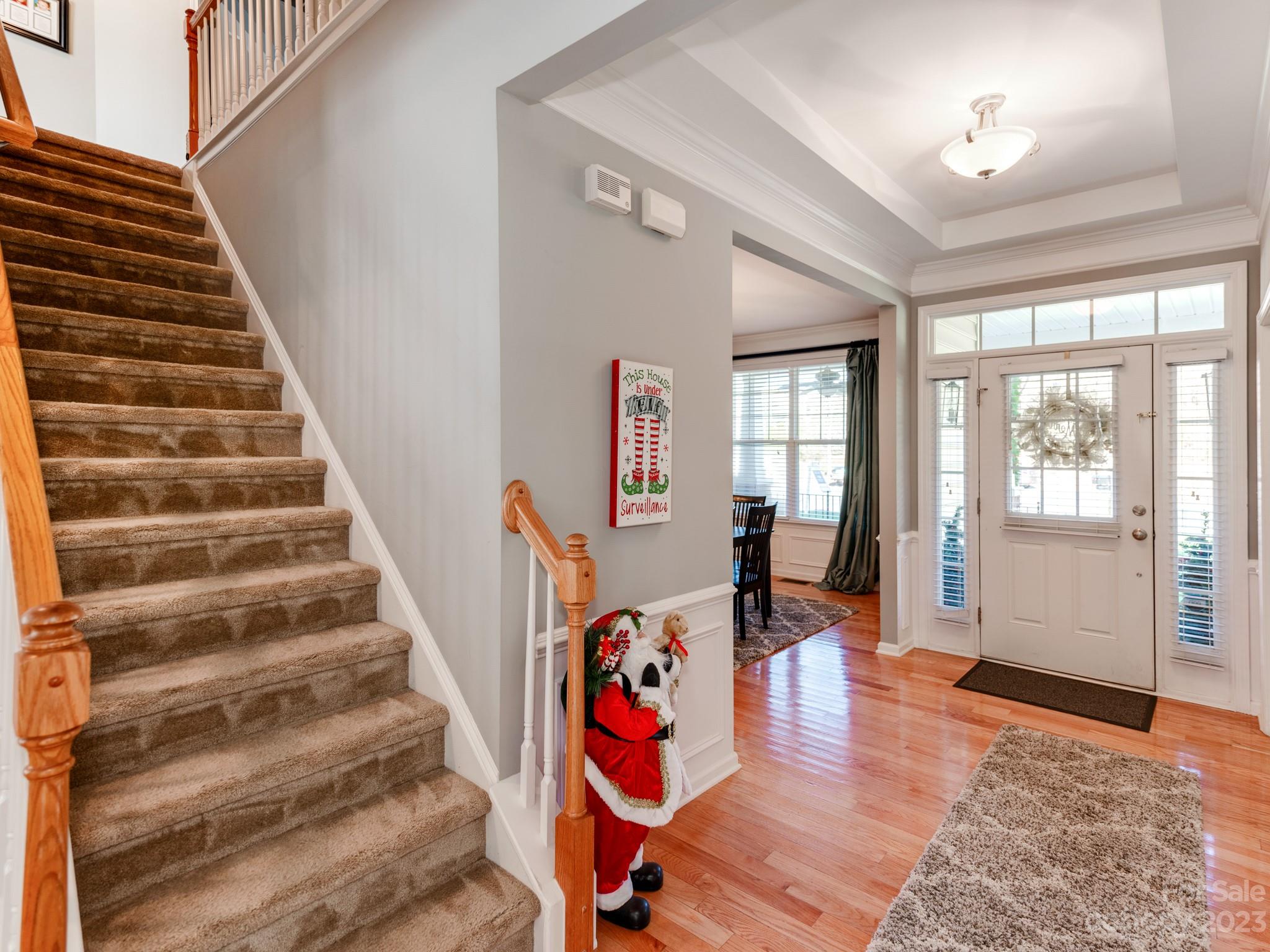 1603 Randwick Way Matthews, NC 28104 - Photo 9 of 48 a view of an entryway with wooden floor and windows