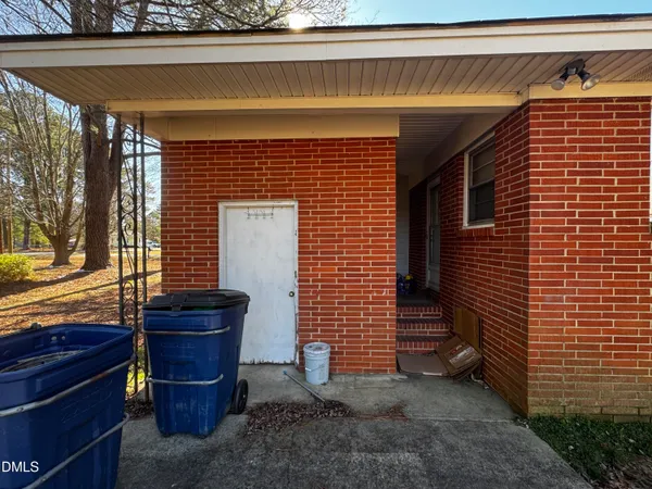 a view of house with wooden fence