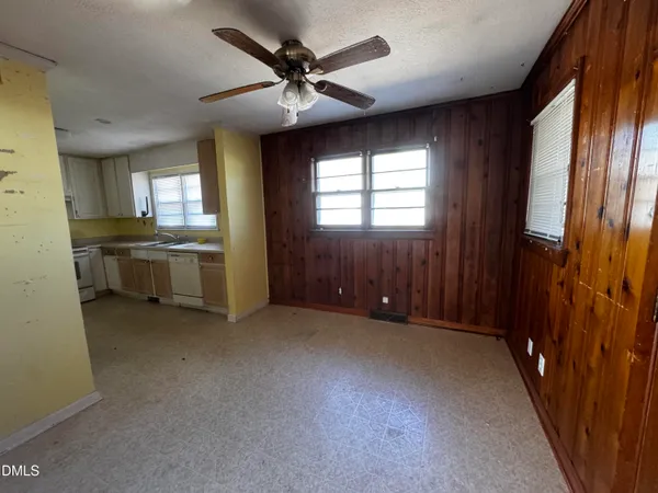 wooden floor in an empty room with a fireplace