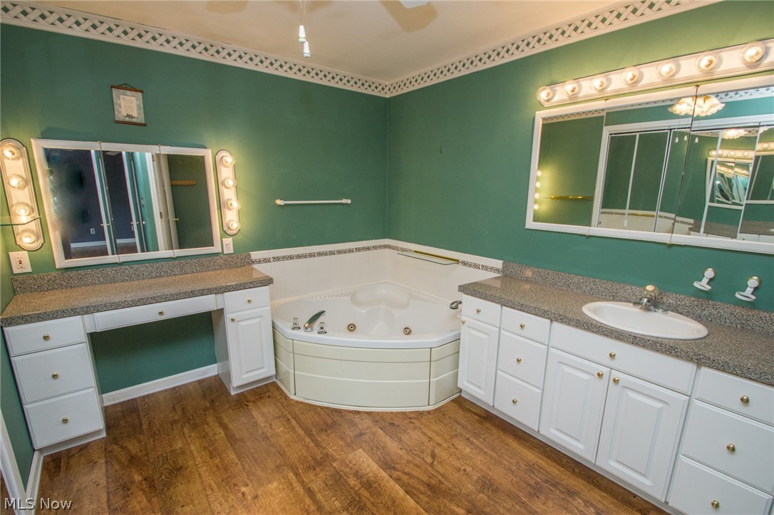 9066 Broadledge Road Macedonia, OH 44056 - Photo 13 of 35 Master Bath, vanity jetted tub and sink