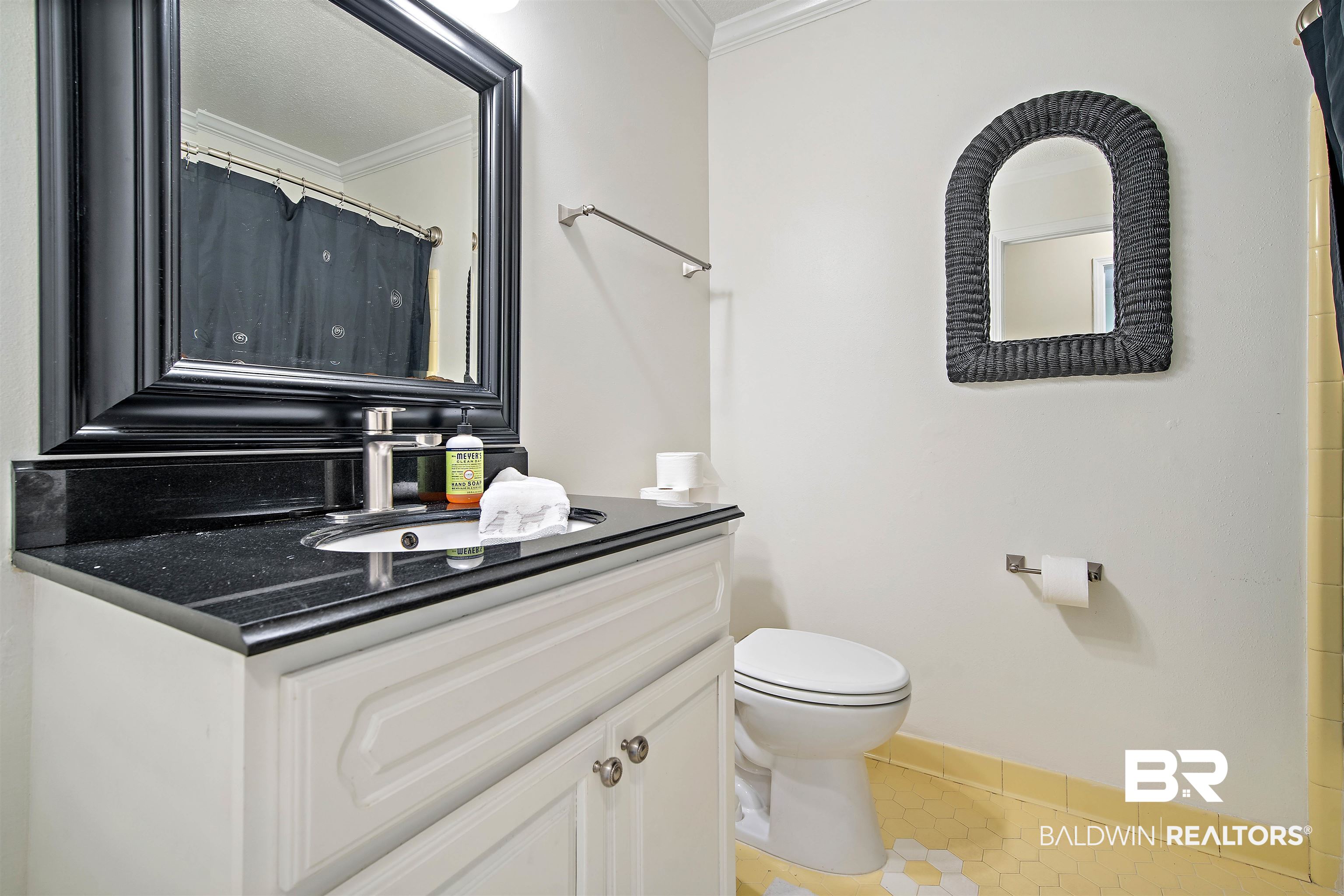 1325 Pawnee Circle Saraland, AL 36571 - Photo 17 of 26 Bathroom featuring tile patterned flooring, crown molding, and vanity