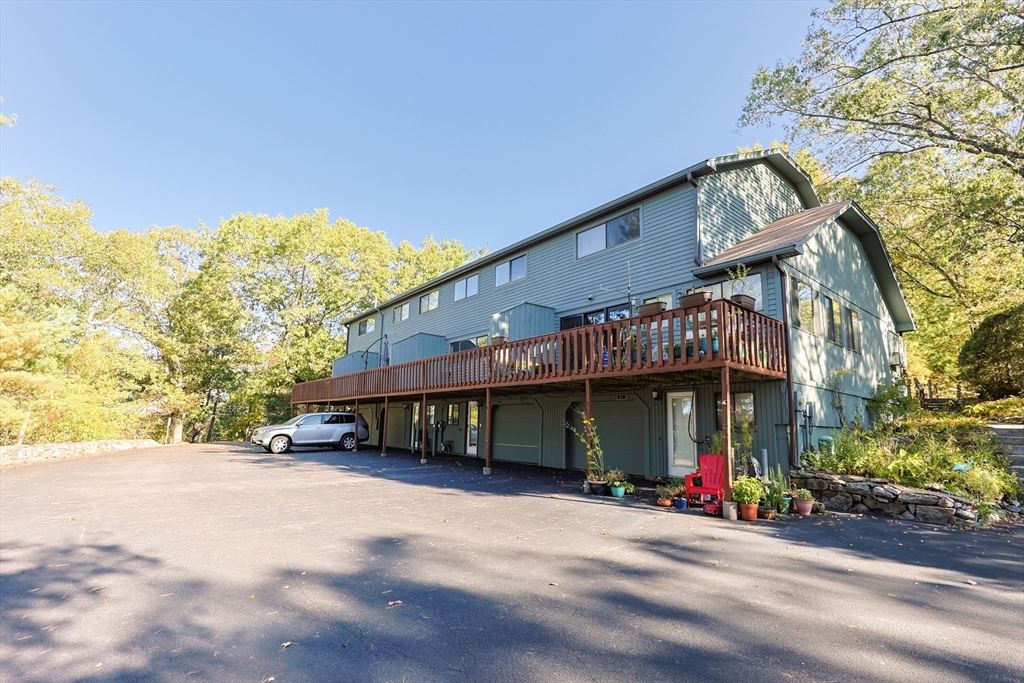 63 Trailside Way, Unit 63 Ashland, MA 01721 - Photo 1 of 39 a view of a building with a trees