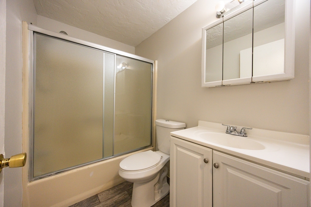 63 Trailside Way, Unit 63 Ashland, MA 01721 - Photo 24 of 39 a bathroom with a sink a toilet and shower