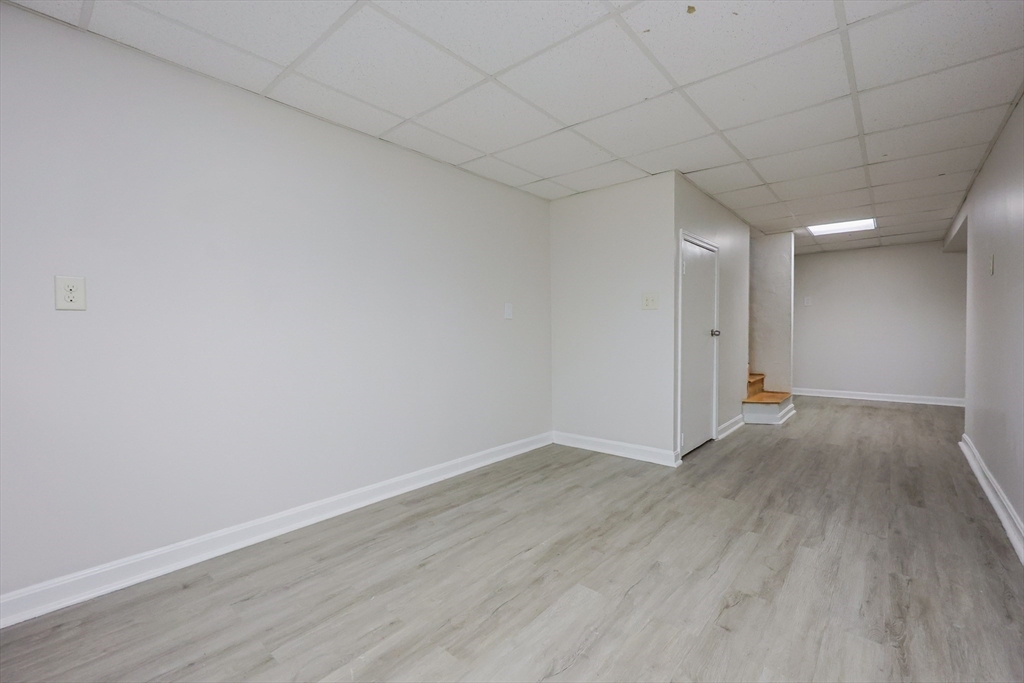 63 Trailside Way, Unit 63 Ashland, MA 01721 - Photo 28 of 39 a view of an empty room with wooden floor