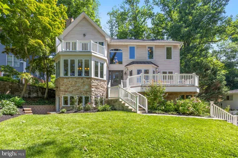 a front view of a house with a yard and porch