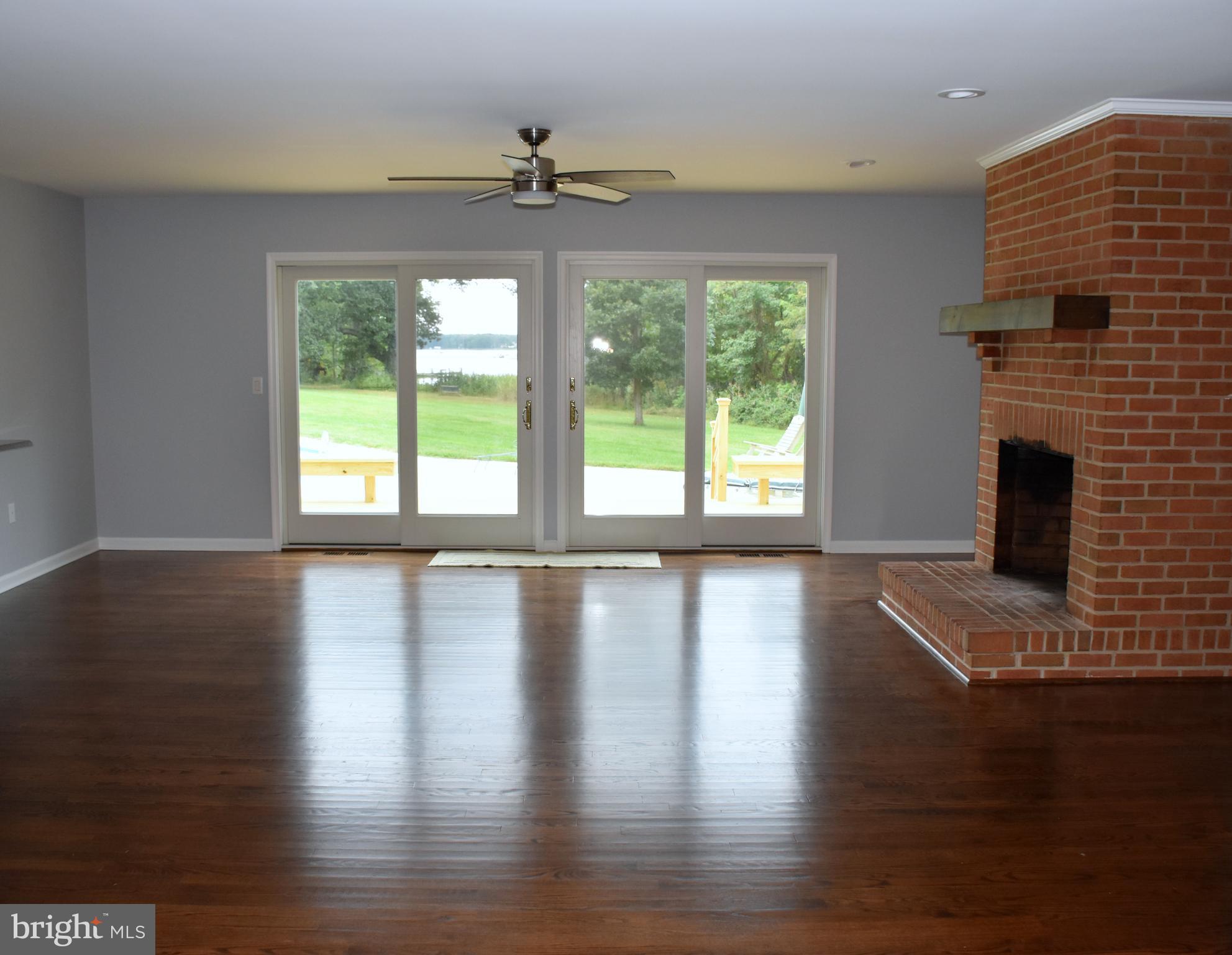 8569 Northbend Road Easton, MD 21601 - Photo 12 of 29 Great room with fireplace