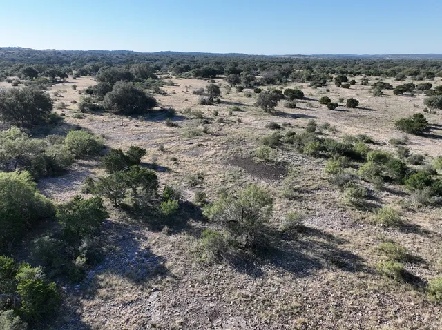 a view of a backyard with sitting area