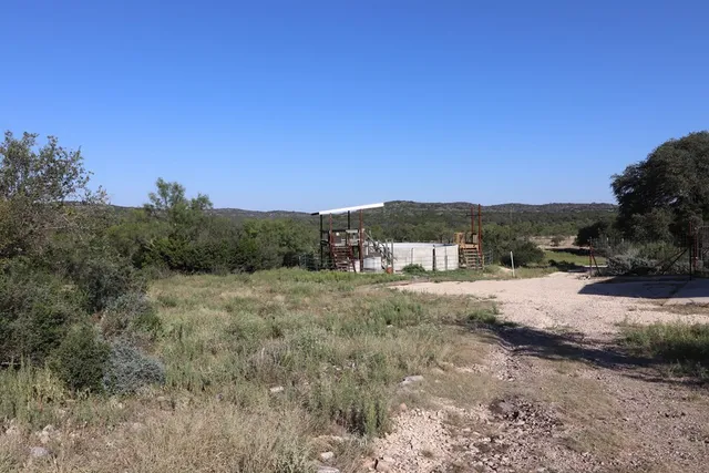 a bathroom with sink a mirror a bathtub and shower