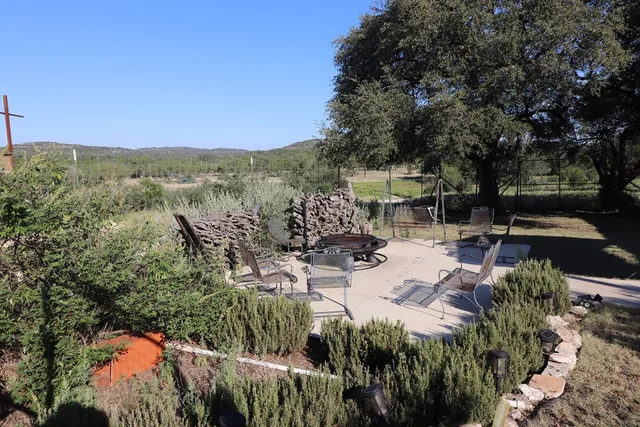 a living room with furniture fireplace and flat screen tv