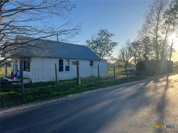 a view of a house with a garden