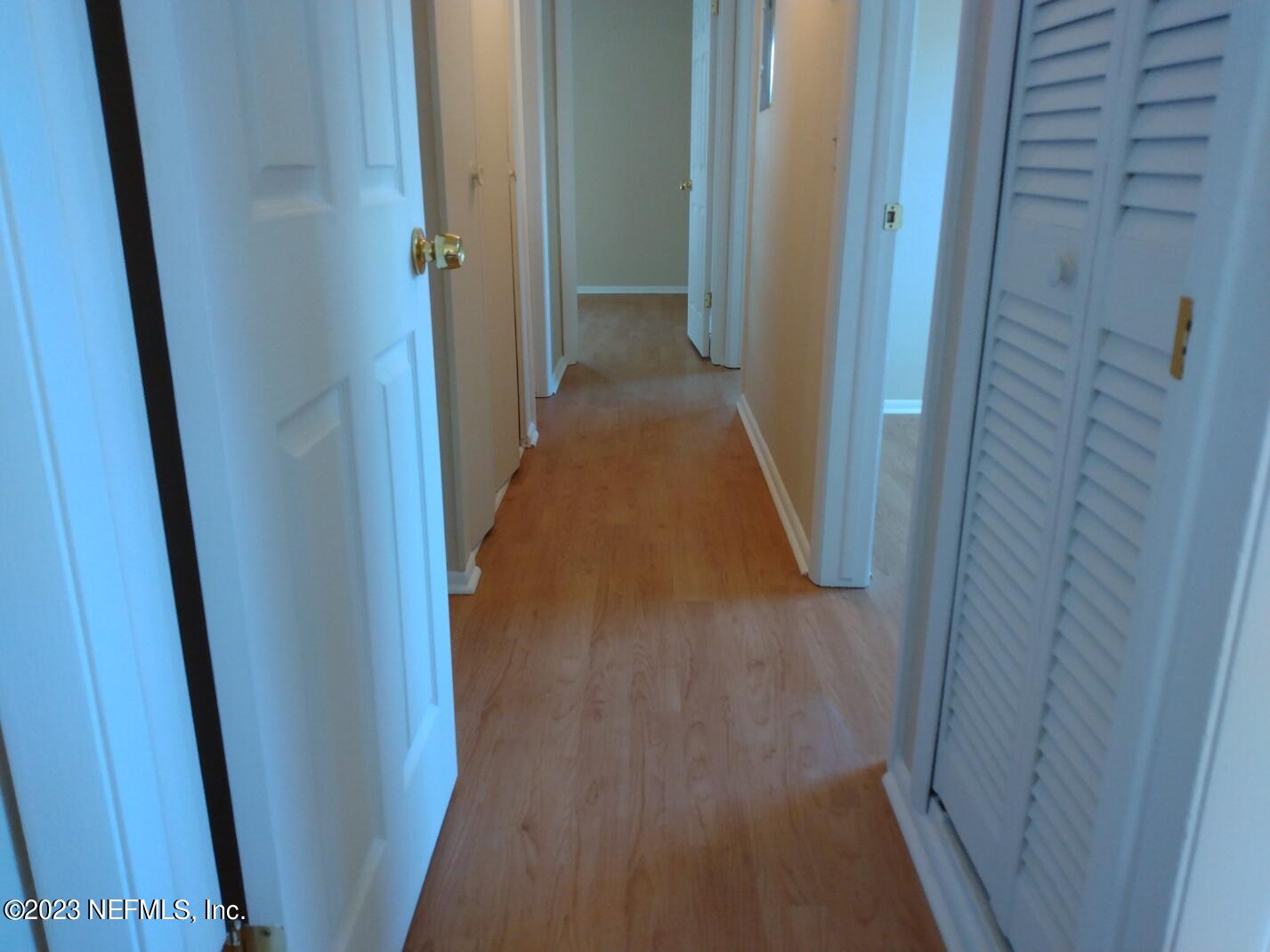 710 Redfin Drive Atlantic Beach, FL 32233 - Photo 11 of 38 a view of a hallway and wooden floor