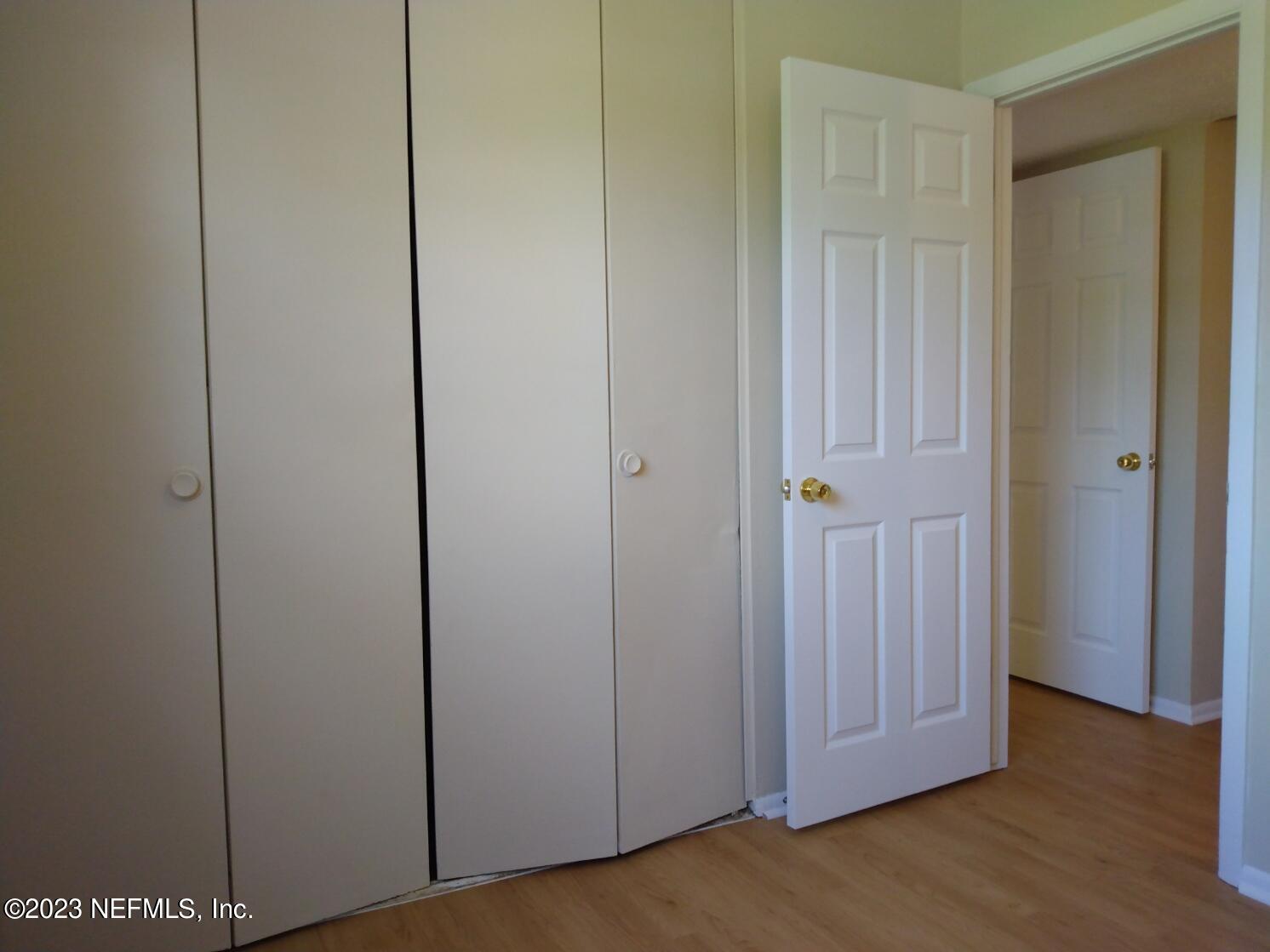710 Redfin Drive Atlantic Beach, FL 32233 - Photo 13 of 38 a view of a room with wooden floor