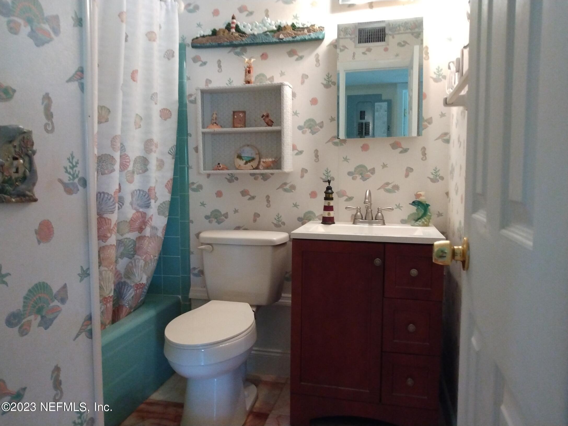 710 Redfin Drive Atlantic Beach, FL 32233 - Photo 19 of 38 a bathroom with a sink toilet and shower