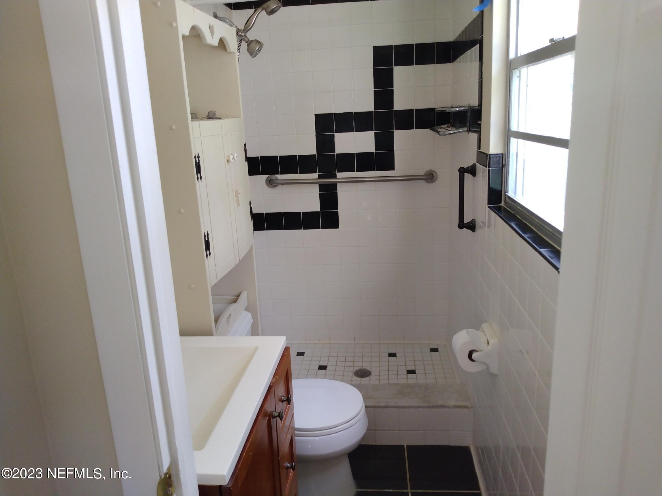 710 Redfin Drive Atlantic Beach, FL 32233 - Photo 23 of 38 a bathroom with a toilet and a shower