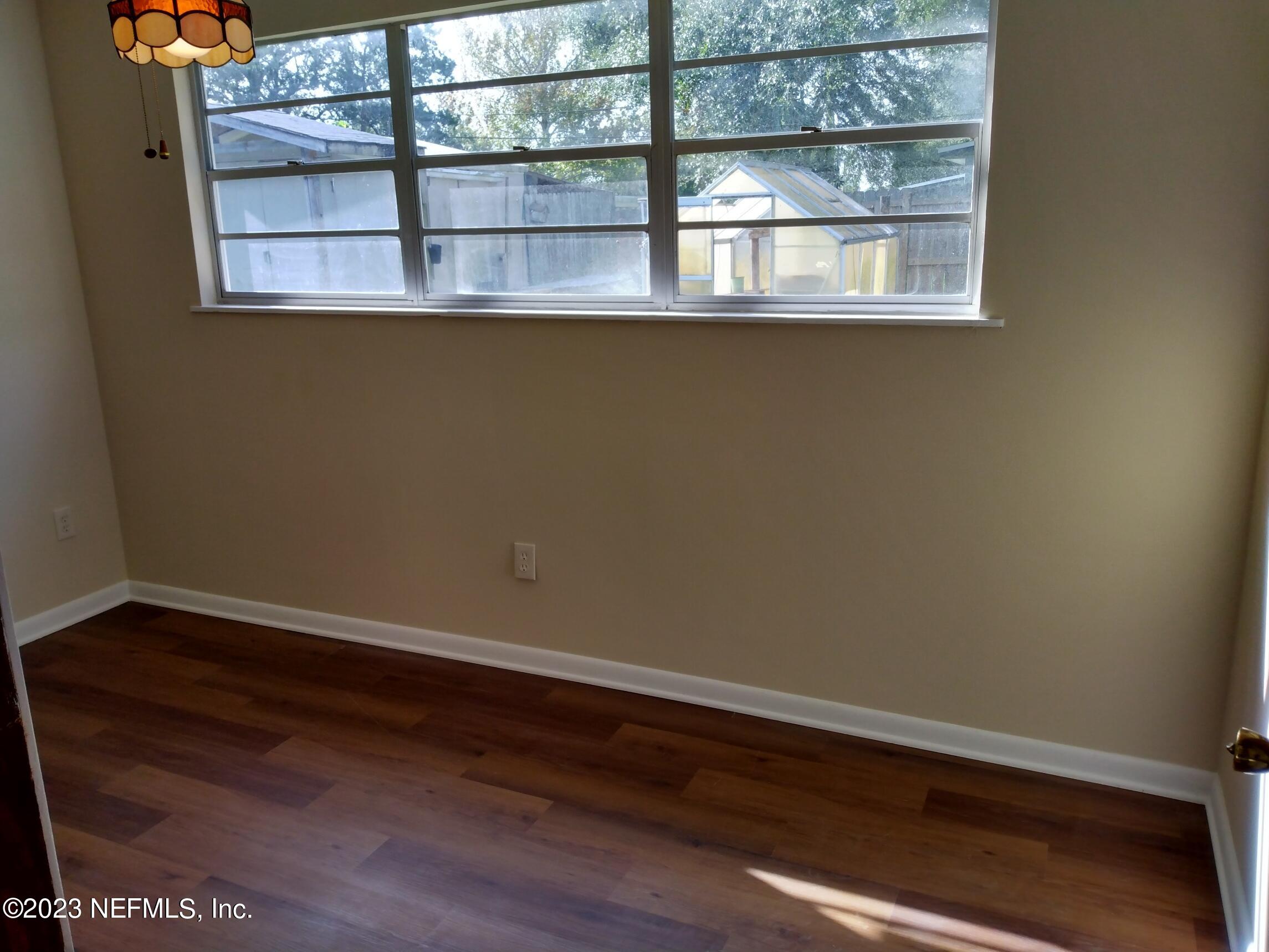 710 Redfin Drive Atlantic Beach, FL 32233 - Photo 25 of 38 a view of a small space with wooden floor and a window