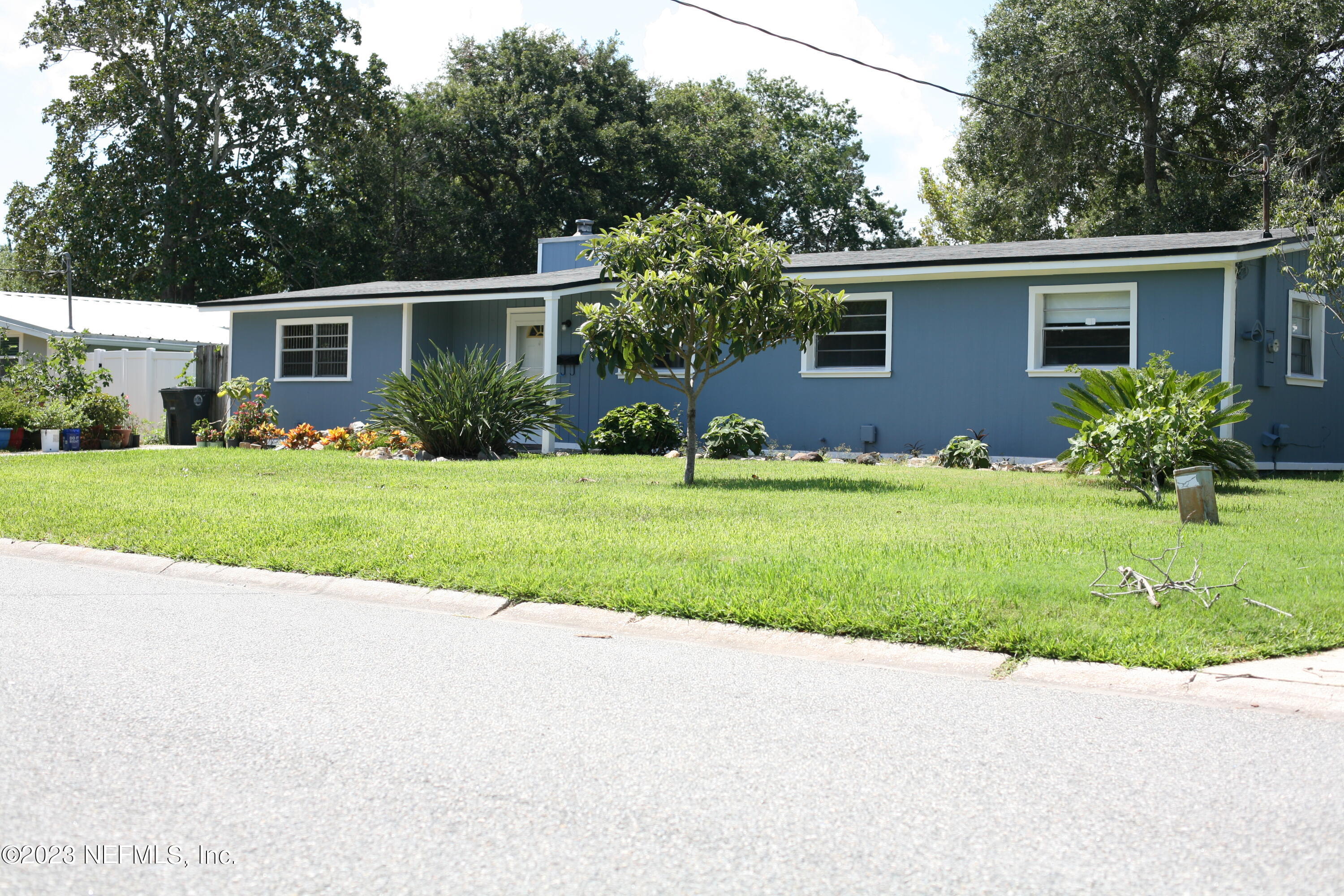 710 Redfin Drive Atlantic Beach, FL 32233 - Photo 3 of 38 a front view of house with yard and green space