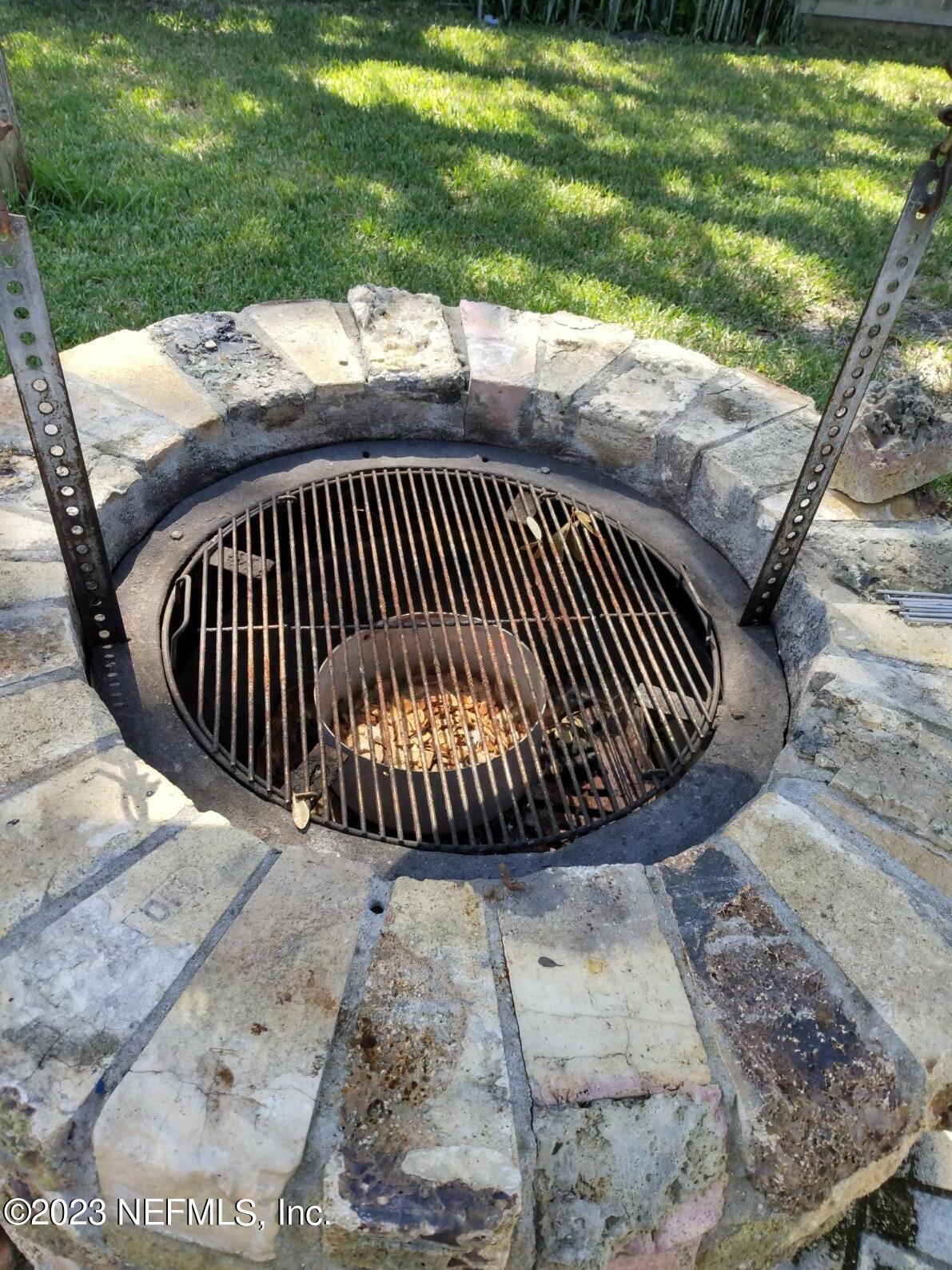 710 Redfin Drive Atlantic Beach, FL 32233 - Photo 38 of 38 a view of a swimming pool with a porch and a yard