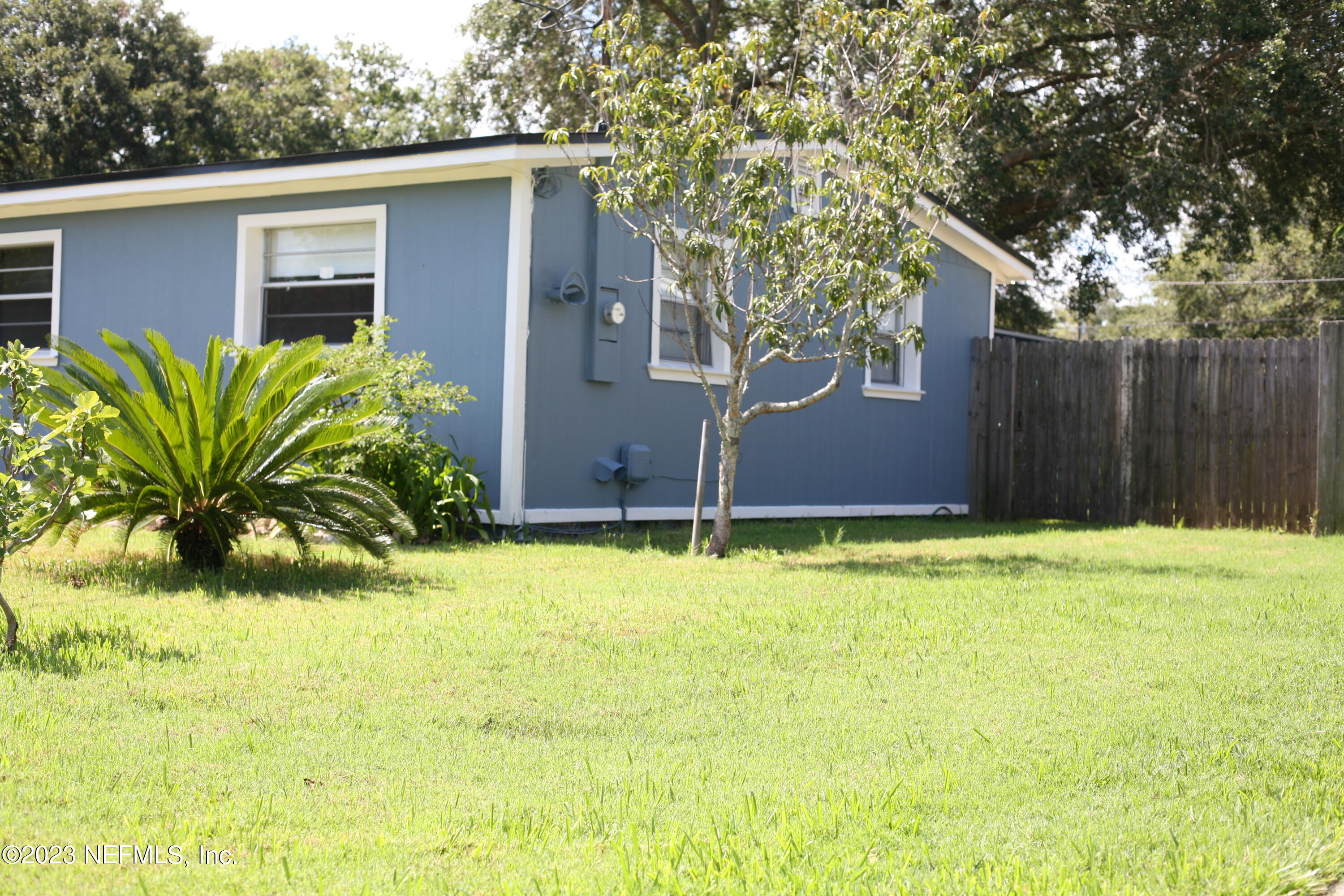 710 Redfin Drive Atlantic Beach, FL 32233 - Photo 4 of 38 a front view of house with yard and trees