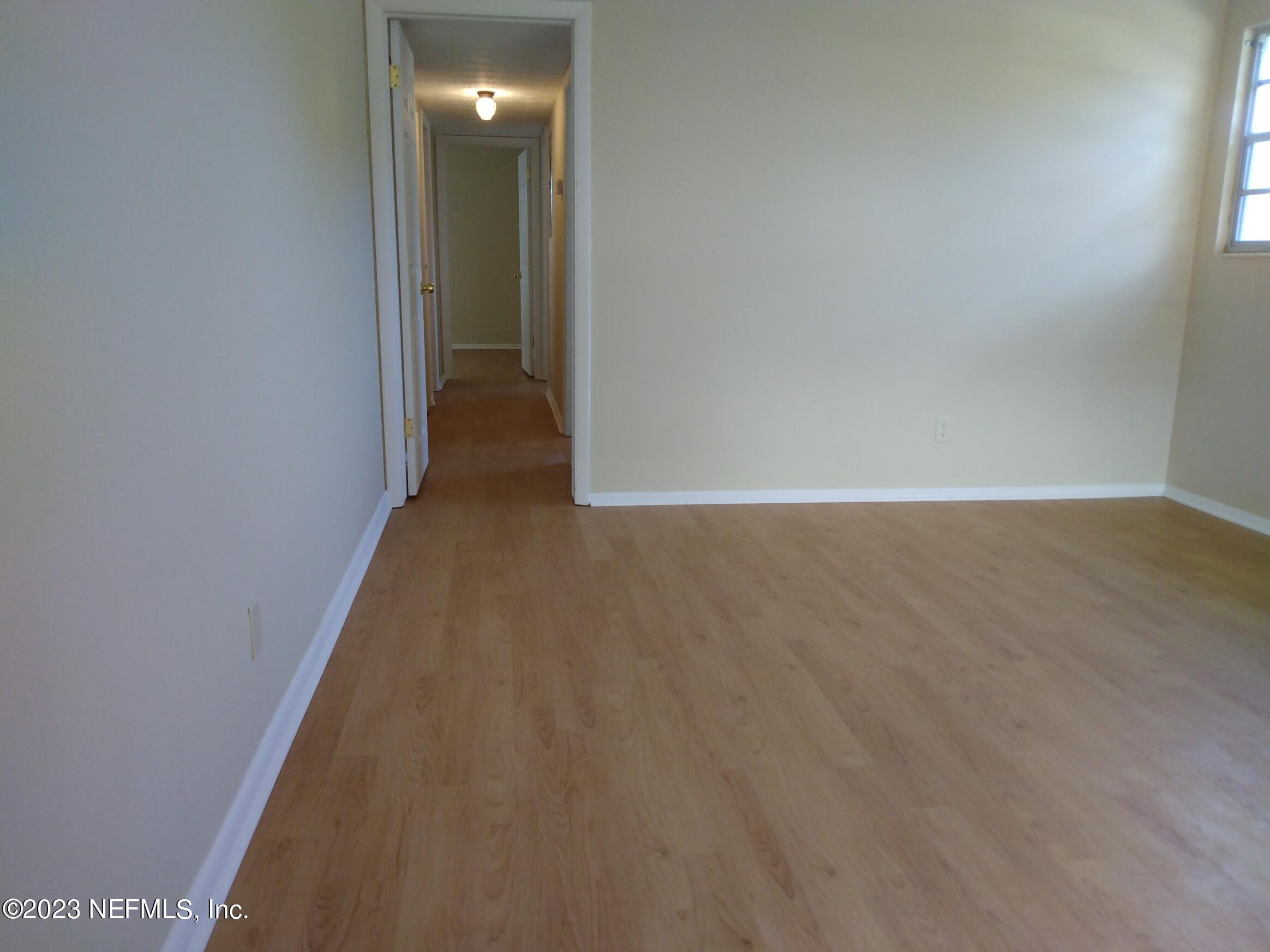 710 Redfin Drive Atlantic Beach, FL 32233 - Photo 10 of 38 a view of hallway with wooden floor