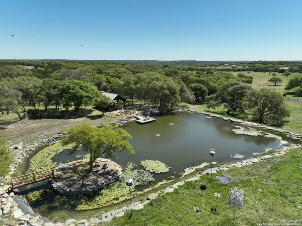 an aerial view of a houses with yard