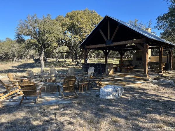a view of a outdoor space with lounge chairs