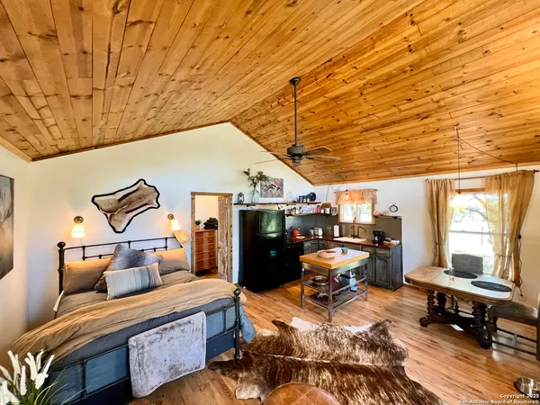 a bedroom with furniture and a window