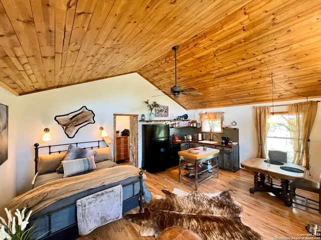 a bedroom with furniture and a window