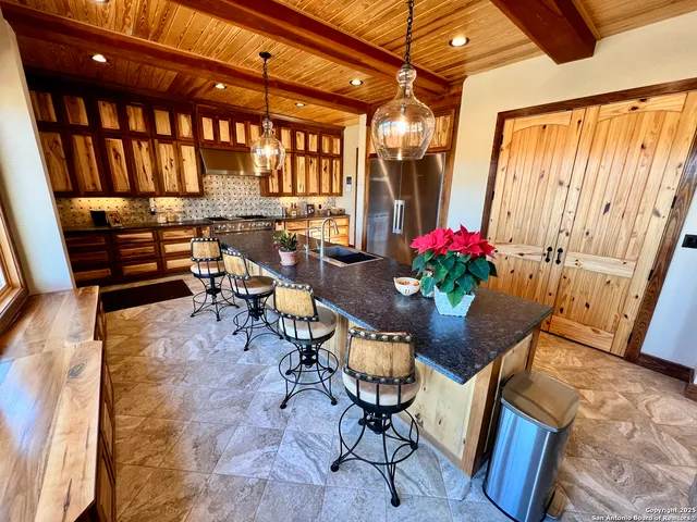 a dining room with furniture and a potted plant