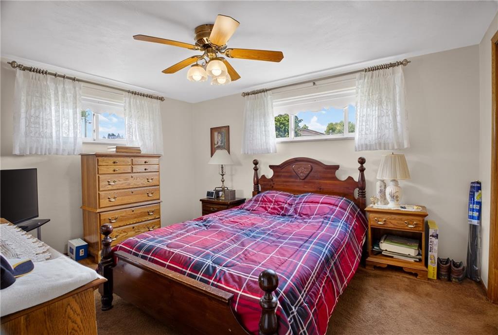 186 William Street McKees Rocks, PA 15136 - Photo 19 of 45 a bedroom with a bed and a chandelier