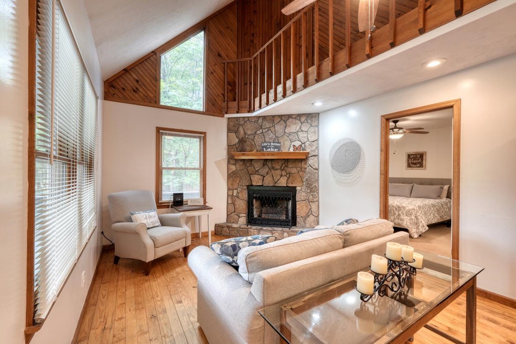 3739 Pat Colwell Road Blairsville, GA 30512 - Photo 11 of 55 a living room with furniture a fireplace and a large window