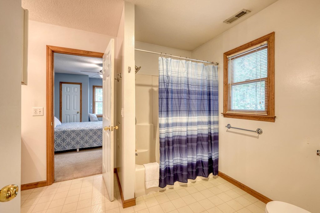 3739 Pat Colwell Road Blairsville, GA 30512 - Photo 30 of 55 a view of a hallway with wooden floor and bedroom view