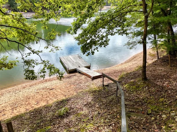 a view of a lake with a yard