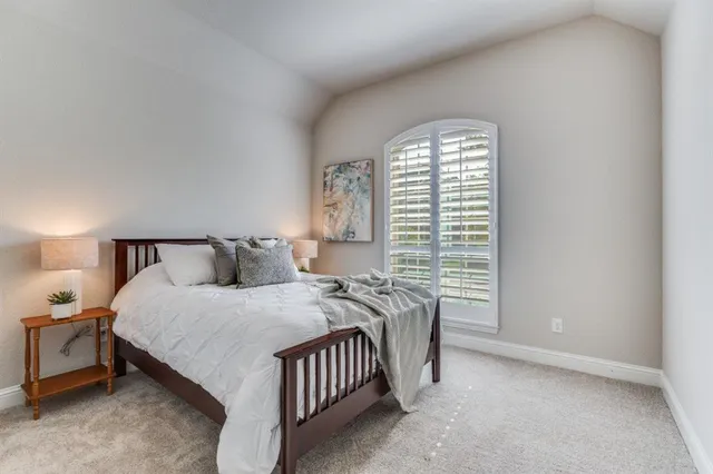 a bathroom with a double vanity sink a mirror and a bathtub