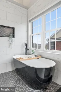 a dining room with a table and chairs